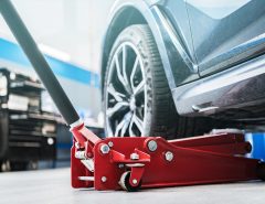 What are the safety precautions when using a car jack