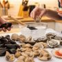 Boston home cook inspecting fresh clams before dinner preparation