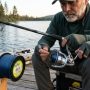 Angler spooling fishing line onto a spinning reel to prevent tangles