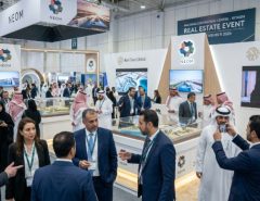 Crowds of real estate professionals exploring landmark project exhibits from NEOM and Red Sea Global on the exhibition floor at Malham convention centre in Riyadh during the November 2026 real estate event