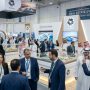 Crowds of real estate professionals exploring landmark project exhibits from NEOM and Red Sea Global on the exhibition floor at Malham convention centre in Riyadh during the November 2026 real estate event