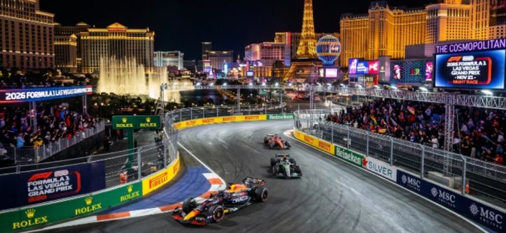 Formula 1 cars racing at night past illuminated Las Vegas Strip hotels along the Las Vegas Strip Circuit during the 2026 Las Vegas Grand Prix on November 21