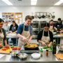 High school students preparing meals together during a cooking club session