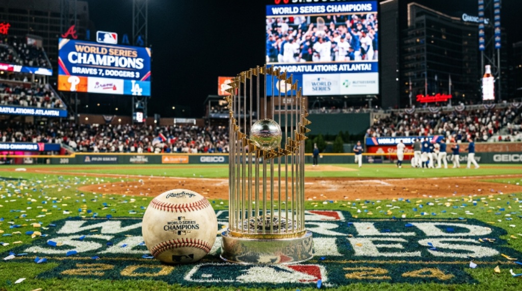 Baseball and championship trophy displayed on a stadium field