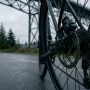 Bike rider checking dual brake dragging on Seattle path