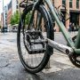 Heavy-duty metal BMX platform pedals installed on an urban commuter bike.