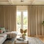 Modern living room in Florida with thick thermal curtains blocking bright sunlight.