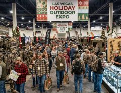 Crowd of shoppers browsing hunting gear booths at the Las Vegas holiday outdoor expo