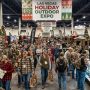 Crowd of shoppers browsing hunting gear booths at the Las Vegas holiday outdoor expo